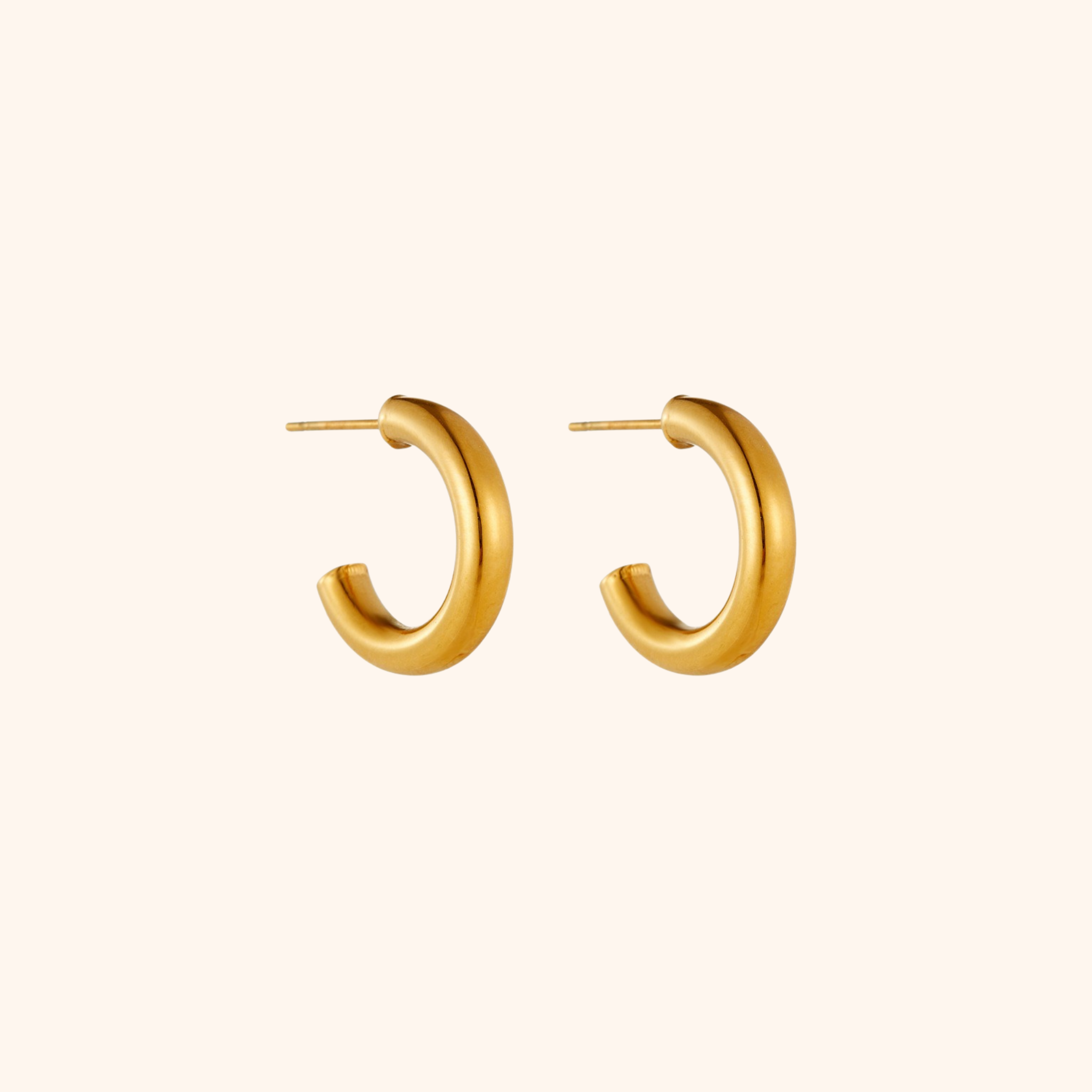 Gold hoop earrings on a white background